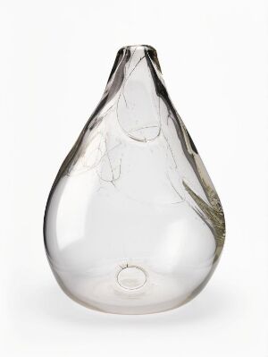  A clear, teardrop-shaped glass object with delicate, smoky inclusions inside, displayed against a plain white background.