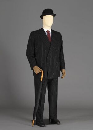  A mannequin dressed in a Herbert Johnson's "Bowlerhatt" ensemble featuring a black pinstriped suit, white shirt, burgundy tie, and a black bowler hat, symbolizing classic formal daywear for men.