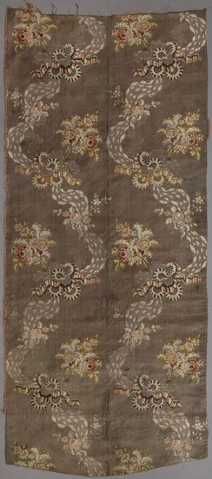  An elongated, ornate textile panel with a gradient brown background and symmetrical creamy beige floral patterns, evoking a classical elegance. Artist name and title are unknown.