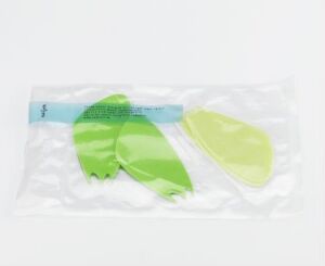  Vacuum-sealed package containing a set of bioplastic tableware in gradient shades of green, designed by Anne Bannick, featuring a modern, ergonomic design. The package includes a knife, fork, and spoon against a white background, emphasizing the eco-friendly and sustainable materials used.