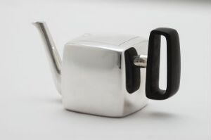  A modern stainless steel cubic watering can with a black handle, set against a plain light grey background.