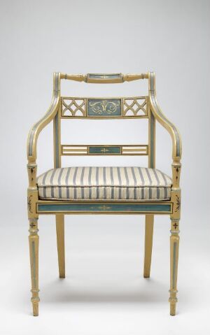  An ornate gold-painted beechwood chair by Joseph Chr. Lillie, titled "Stol," featuring delicate turned and carved details. The chair displays a gold finish with aged patina, a central backrest panel bordered by spindles, and a striped silk-upholstered seat in pale cream and blue-green hues.