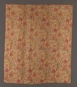  An intricately designed textile featuring a dense, intertwining foliage pattern in warm shades of red, orange, and gold on a natural, earthy background, possibly used for decorative purposes.