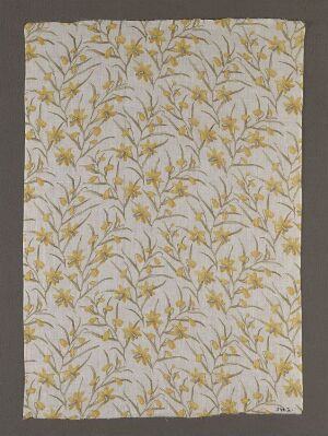  A piece of fabric or wallpaper with a repetitive golden yellow botanical pattern of arching stems and leaves on a pale beige background, evoking a vintage aesthetic.