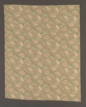  A patterned material or paper with a repeating design of intertwined floral motifs in muted shades of green, pink, and beige against a light sandy background, conveying a sense of classic elegance.