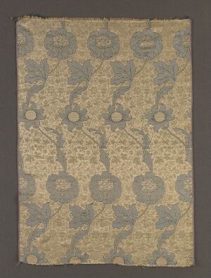  Silk fabric titled "Kennet" designed by William Morris, featuring a beige-gold background with intertwined sage green and soft blue foliage, rich blue floral and circular motifs, interlaced with grayish lace-like patterns in a complex weaving technique reflecting the Arts and Crafts movement.