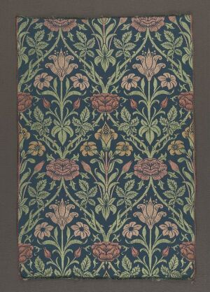  Handwoven silk and wool fabric with a composite weave, titled "Rose and Lily" by John Henry Dearle, featuring symmetrical patterns of roses in pink and peach and lilies in softer shades amidst densely arranged green foliage on a deep blue-green background.