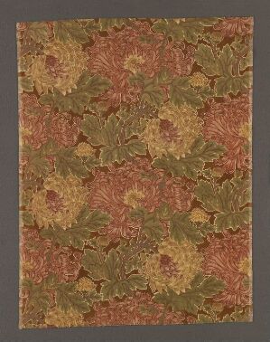  A patterned image with a warm-toned, mottled background in reds, oranges, and yellows, overlaid with detailed green leaf shapes resembling grape or vine leaves, suggesting an autumnal textile or decorative paper pattern.