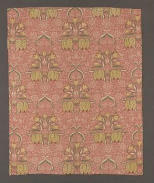  A rectangular textile piece with a dense and symmetrical floral pattern in gold, green, and white on a salmon pink background.