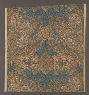  "Honeysuckle" by William Morris, a machine-woven cotton fabric with a symmetrical pattern of honeysuckle flowers and foliage in shades of green, blue, beige, and muted yellows, displayed against a neutral background.