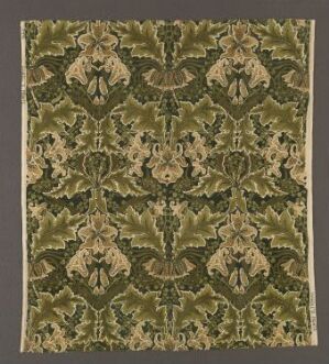  "Crown Imperial" by Thomas Wardle, a machine-woven cotton velvet textile showing a symmetrical, printed floral pattern in shades of olive green with golden beige motifs on a twill background.