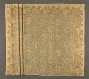  Antique textile with intricate golden floral pattern on a muted beige background, flanked by two simple bordered edges, displayed against a neutral backdrop.