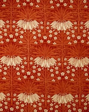  A machine-woven silk fabric titled "Crown Imperial" by Liberty & Co, showcasing a terracotta-colored background with a pattern of cream inverted floral clusters and smaller floral details, displaying traditional elegance in design and textile art.