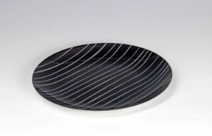  Stainless steel plate with opaque black enamel and curved white lines designed by Grete Prytz Kittelsen.