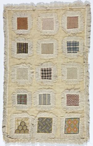  "Stoppeduk fra Øyestad ved Arendal" by Smidt, frk. - A handwoven wool textile in cream showcasing twelve embroidered squares with various patterns and colors in rust, blues, browns, and orange, each square with a different design ranging from solid colors to intricate motifs.