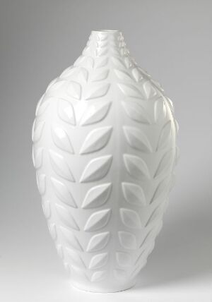  A glossy white feldspar porcelain vase by Konrad Galaaen with a raised leaf pattern in a symmetrically layered design, emphasizing texture and organic form.