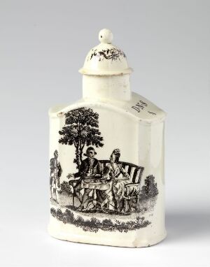  An antique off-white porcelain mustard pot with a black print depicting an 18th-century pastoral scene, featuring two figures seated around a small table under a tree, on a light grey background.