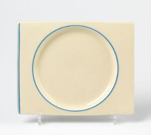  Square cream-colored stoneware plate with rounded edges and a hand-painted blue concentric circle near the rim, designed by A.J. Wilkinson.