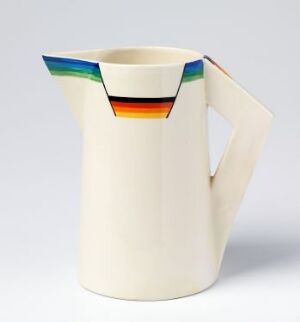  A Clarice Cliff ceramic jug with a cream base and a colorful top rim, featuring stripes in green, blue, black, orange, and deep blue. The jug has a sleek, modern design with a curved handle to the side, capturing a distinctive 20th-century aesthetic.