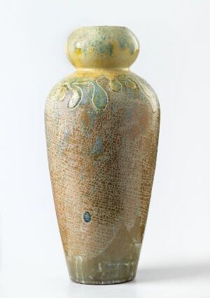  An elongated vase-like object with a textured, sandy surface displaying crackling patterns and subtle blue-green and olive accents. The domed top seems to act as a stopper, blending muted yellow and green hues. The object is set against a soft-white background. Artistname and title are unknown.