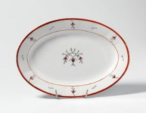  An oval porcelain platter by Porsgrunds Porselænsfabrik AS featuring a clean white background with a red border and subtle hand-colored, floral-like decorations along the rim and at the center.