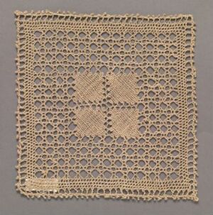  An antique square lace doily with a complex, symmetrical floral pattern, displayed against a neutral taupe background.