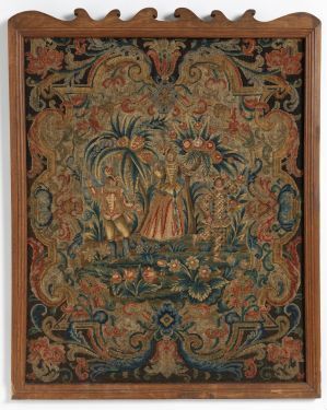  An antique embroidered tapestry featuring a central palm-like tree motif flanked by animal figures among a dense pattern of foliage and floral elements in subdued earthy tones, with a scalloped border at the top. Artist name and title are unknown.