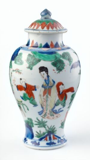  A porcelain vase with a bulbous body and flared neck, decorated with a blue, green, red, and orange hand-painted design featuring a traditional figure and botanical patterns, topped with a domed lid with a pointed knob.