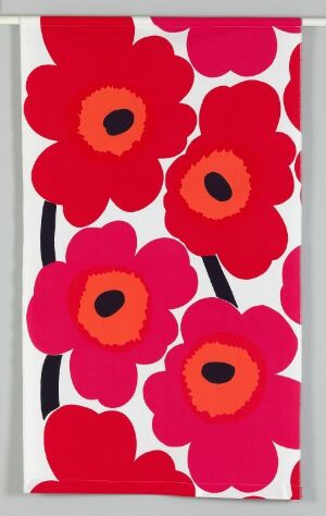  "Unikko" by Maija Isola, a textile design featuring a vibrant pattern of large red poppy flowers with blackish-navy centers surrounded by orange, on a white background with black stems, made with machine-woven cotton fabric in plain weave with a printed pattern.