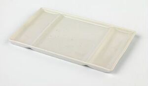  A simple rectangular beige styrofoam tray with three compartments against a white background.