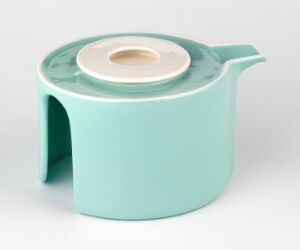  A modern, minimalist pastel turquoise teapot with an integrated handle and a recessed lid with a white rim and a matching turquoise knob, set against an off-white background.