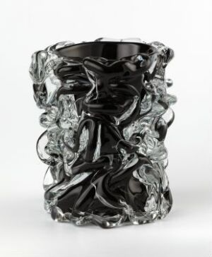  A glossy black glass vase with intricate folds and swirls of clear glass, displaying a dynamic and sculpted texture.