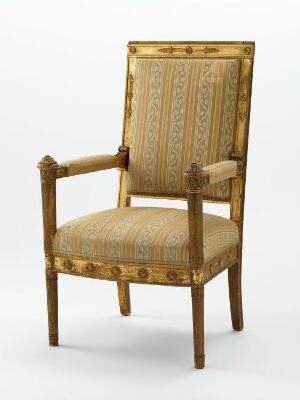  An elegantly designed neoclassical armchair by Hans Ditlev Frants Linstow titled "Lenestol," featuring a wooden gold-gilded and relief-carved frame with squared legs and armrests, upholstered with a patterned silk fabric in shades of gold.