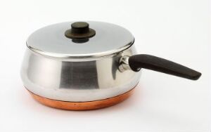  A modern, mid-century cooking pot designed by Sigvard Bernadotte, featuring a polished stainless steel body with a copper base and a bakelite handle and lid knob, set against a plain white background.