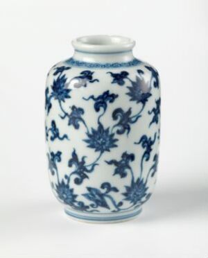  A cylindrical porcelain vase with a narrow neck and flared rim, adorned with traditional blue-and-white floral motifs covering the entire surface.