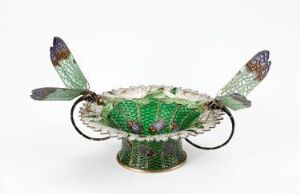  "Libelleskålen" by Gustav Gaudernack, a gilded silver filigree bowl with translucent green and multicolored enamel resembling a dragonfly, with detailed wings transitioning from purple to blue to green.