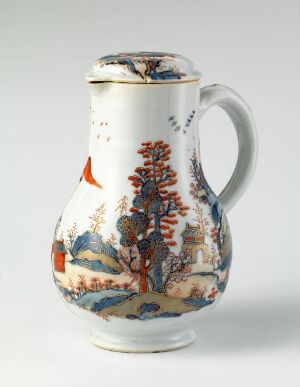  A white ceramic jug with a single handle, intricately decorated with a colorful scene featuring an orange bird, autumnal trees, an Eastern-style pagoda, a bridge over a blue stream, and various floral and cloud motifs.