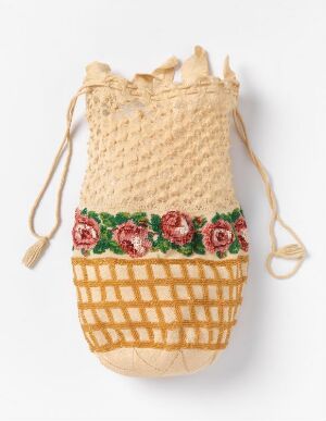  A beige woven drawstring pouch with a band of rose embroidery and a gold-and-beige checkered bottom section against a white background.