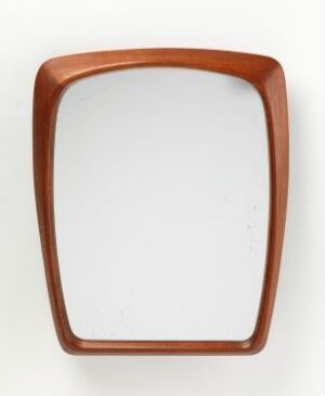  A teak wood-framed mirror with a trapezoidal shape and rounded edges, designed by Thorbjørn Rygh, entitled "[Uten tittel]". The warmth of the wood provides an inviting, natural element to the piece, indicative of mid-century modern design.