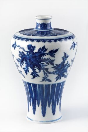  A traditional Chinese blue and white porcelain vase with intricate floral and leaf patterns, displayed against a neutral background.