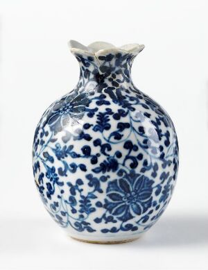  A white Chinese porcelain vase with blue floral patterns, exhibiting a bulbous body and a flared neck, with a glossy finish.