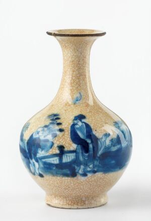  An elegantly shaped vase with a beige, textured appearance and a painted blue landscape around its midsection, featuring a blend of deep and light blue hues, set against a white background.