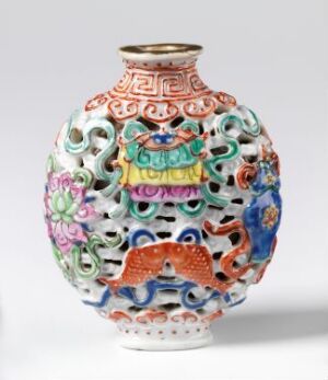  Porcelain vase with a reticulated design and raised, multicolored enamel decorations including floral patterns and geometric shapes, set against a plain background.