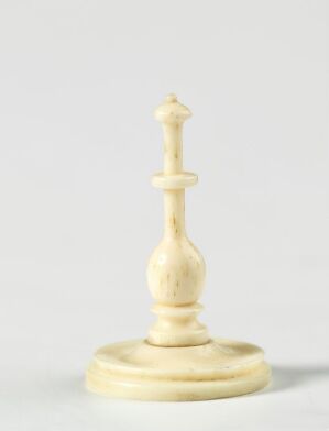  An image of a white bishop chess piece with a marbled texture, set against a plain, light background.