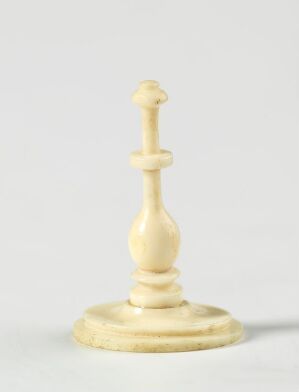  A single white bishop chess piece with a classic design, displayed against a light grey background.