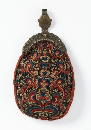  An ornate, oval-shaped pouch with intricate red, green, and gold floral patterns on a dark background, featuring a decorative metallic clasp at the top. Artist name and title are unknown.