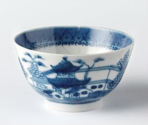  An elegant white porcelain bowl with intricate blue patterns, including a central design and decorative bands, suggestive of traditional blue and white porcelain craftsmanship.