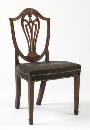  An antique-style wooden chair with a high, curved backrest featuring an open, lyre-like design, and a dark green upholstered seat with brass nailhead trim.