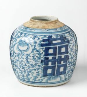  An old, bulbous blue and white ceramic jar with traditional Chinese patterns. The jar's intricate design features cloud-like motifs and stylized geometric shapes, possibly representing windows or gates. The base of the jar is unglazed and reveals the natural beige color of the clay.