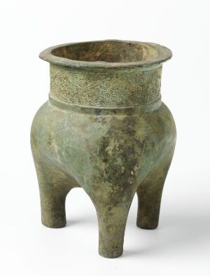  An ancient bronze vessel called "Li" with a three-legged design and a decorative relief band near its rim. The texture showcases patches of verdigris, indicating its historical age and use. Artist name unknown.